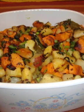 A bowl of food that is on the table.