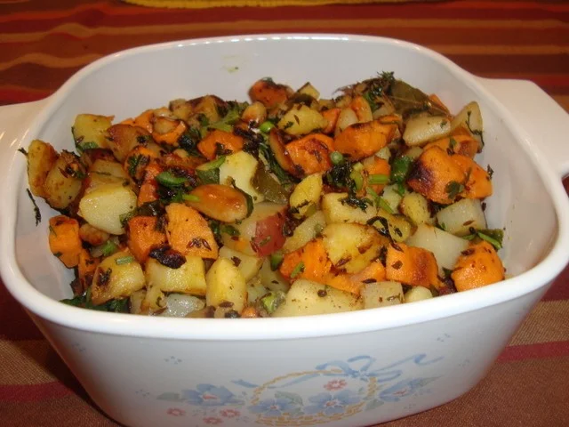 A bowl of food that is on the table.