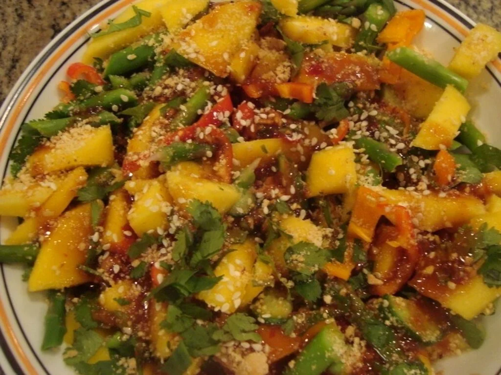 A plate of food with many different vegetables.