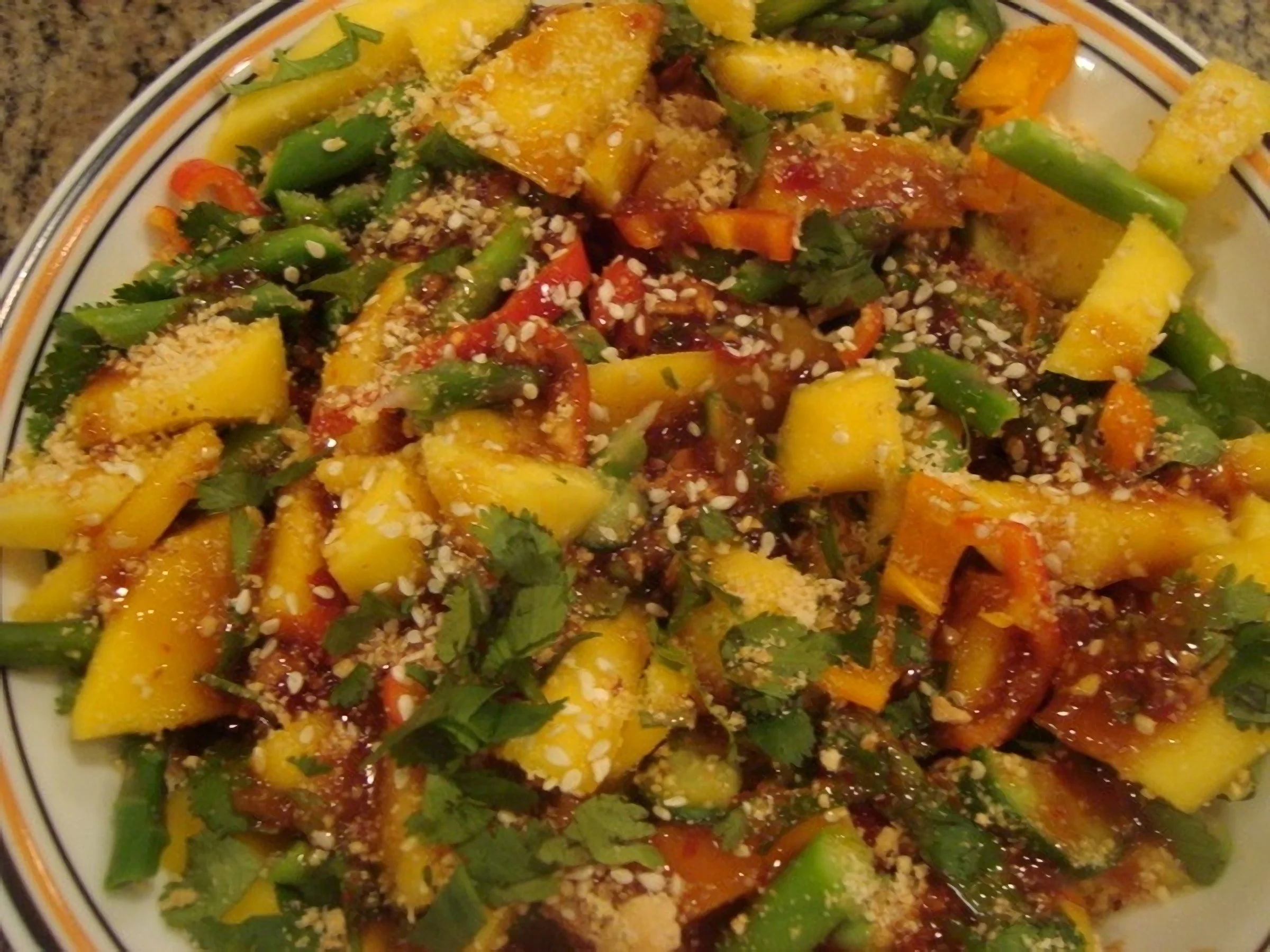 A plate of food with many different vegetables.