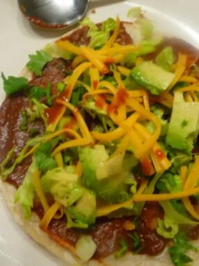 A plate of food with meat and vegetables on it.