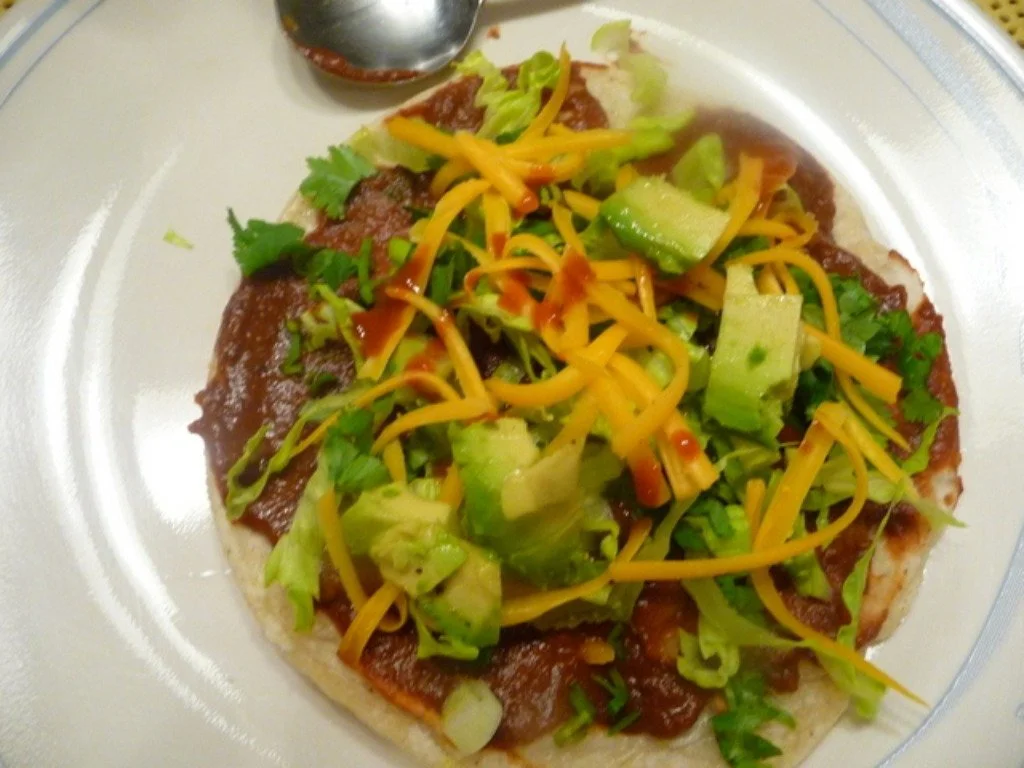 A plate of food with meat and vegetables on it.