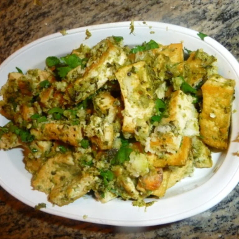 A white plate of food on top of a table.