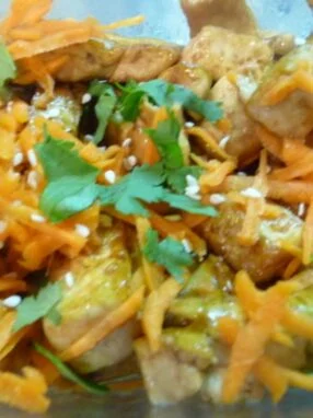 A close up of some food with carrots and meat