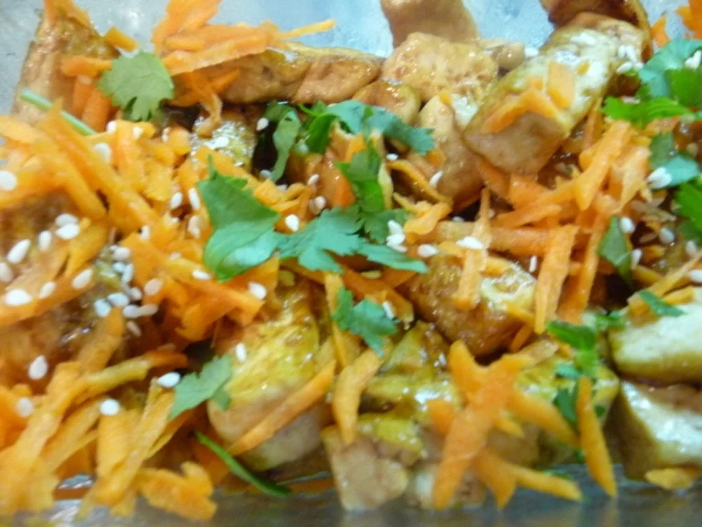 A close up of some food with carrots and meat